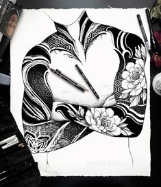 a black and white drawing of a woman's face with flowers on her arm