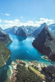 an aerial view of the mountains and water in new zealand, looking down on it