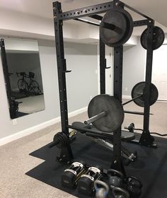 a home gym is shown in the middle of an empty room