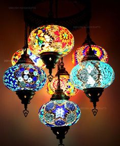 a chandelier with many colorful lights hanging from it