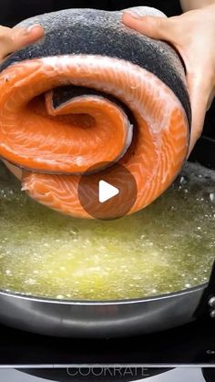 someone is cooking salmon in a pan on the stove