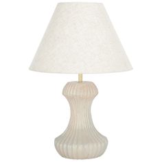 a white table lamp with a beige shade on the base and a gold - plated metal base