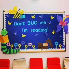 a bulletin board that says don't bug me i'm reading with butterflies and flowers