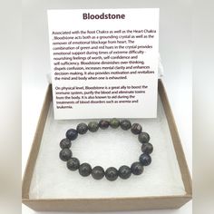 a box with a bracelet in it that has blood stone written on the front and side