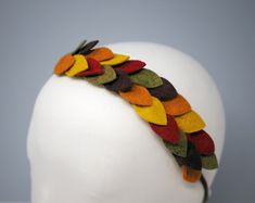 If Thanksgiving was a headband, this would be its official fall hair bow for family photos and autumn wedding flower girls! Classic lines and beautiful autumn hues collide with leaves of green, red, orange, mustard yellow and brown forming a laurel-inspired boho flower crown perfect for babies and adults.Each handmade felt floral vine headband is composed of about two dozen wool blend felt leaves in alternating tones. These leaves are glued by hand to a soft felt backing that slips onto a soft a Vine Headband, Fall Hair Bow, Leaf Headband, Greek Costume, Daisy Headband, Thanksgiving Wedding, Flower Hair Bows, Boho Flower Crown, Leaves Headband