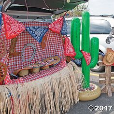 the back of a car is decorated with various items and decorations, including an umbrella