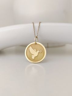 Pendant Material: 14K Solid Real Gold (NOT GOLD PLATED) Hallmark for certification engraved on the back: 585 Pendant Dimensions: - 13mm / 0.51 inches diameter - 15mm / 0.59 inches diameter - 16mm / 0.62 inches diameter - 18mm / 0.70 inches diameter - 20mm / 0.78 inches diameter *Real images of the pendant, size 15mm / 0.59 inches diameter* Thickness: 0.5mm Jump ring inner diameter: 4mm Chain Material: 14K Solid Real Gold (NOT GOLD PLATED) Chain Length available: - No Chain - 35 cm / 13,7 inches Dove Necklace, Real Images, Dove Bird, Pendant For Women, Jewelry Personalized, Bird Pendant, Custom Pendants, Necklace Dainty, Gift Jewelry