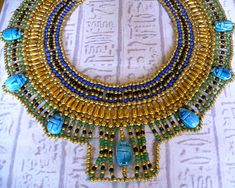 Handmade in Egypt by local craftsman. This outstanding and stunning necklace is handmade in true ancient Egyptian tradition with seed beads and genuine handmade Egyptian scarab beads.    The perfect piece of jewelry for an Egyptian fancy dress costume. $ Egyptian Fancy Dress, Egyptian Collar, Egyptian Party, Travel International, Egypt Jewelry, Ancient Egyptian Jewelry, Egyptian Necklace, Egyptian Inspired