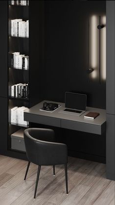 a desk with a laptop on it in front of a book shelf and bookshelf