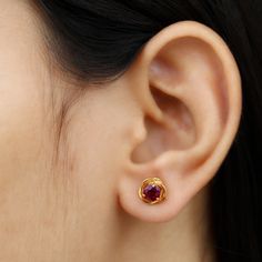 Product Details Designed with elegance, these Swirl Stud Earrings crafted in Solid Gold are Adorned with Round Cut Rhodolite Solitaire to complement your attire for special occasions. Product Information SKU SHP-EARRINGS062196639 Length 9 mm Width 9 mm Height 3.7 mm Weight 2.02 gm (Approximate) RHODOLITE INFORMATION No.of Stones 2 Pieces Total Weight 1.20 Carat (Approximate) Dimension(approx) Round-5X5 mm-2 Pcs Color Red Cut Brilliant Shape Round Setting Type Prong-Setting Quality Grade AAA View Gold Studs Designs, Ear Rings Studs Gold, Gold Earrings Stud, 2 Gm Gold Earrings, Round Ruby Solitaire Jewelry, Gold Ruby Round Jewelry, Gold Round Ruby Bridal Earrings, Classic Gold Ruby Earrings, Gold Earrings Studs Simple