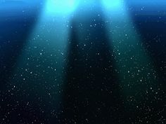 an underwater scene with two spotlights shining in the dark blue water and stars above