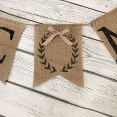 burlap banner with monogrammed letters on it