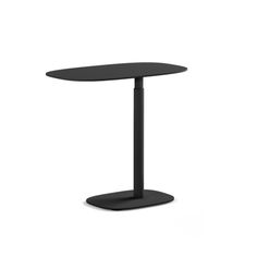 a black table sitting on top of a white floor