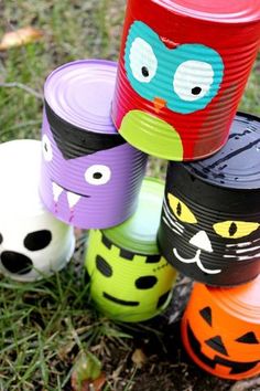 halloween cups with faces painted on them and the words paint old soup cans to make scary monsters