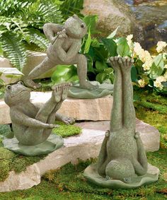 two statues of monkeys playing with each other