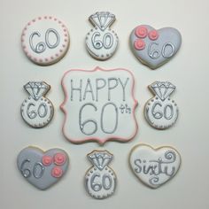 decorated cookies are arranged in the shape of 60 and sixtyth birthdays for someone's 60th