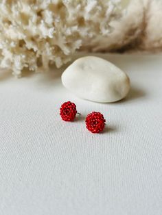 Make your everyday outfit more shiny wearing these red beaded post earrings. These statement stud earrings are made from Miyuki Delica seed beads and supplied with stainless steel accessories. So lightweight and comfortable to wear, these dainty beaded studs would be the perfect addition to your holiday look. If you're looking for delicate seed bead earrings for winter, this pair is a great finding for you. Also, these minimalist earrings are making a great Christmas gift for bohemian jewelry lo Elegant Red Beaded Earrings For Gift, Festive Red Beaded Earrings For Pierced Ears, Elegant Red Earrings With Tiny Beads, Red Metal Beaded Earrings For Pierced Ears, Red Beaded Small Hoop Earrings, Beaded Studs, Red Beaded Earrings, Beaded Rose, Red Bead Earrings