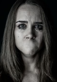 a black and white photo of a woman's face