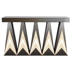 an art deco console table with black and white geometric design on the top, in front of a white background