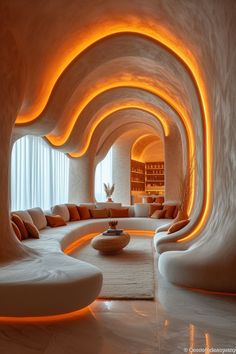 a living room filled with lots of white furniture and walls covered in orange light strips