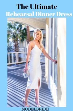 a woman in a white dress is standing on the porch with her hand out and looking at the camera