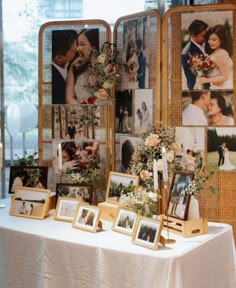 a table with pictures and flowers on it