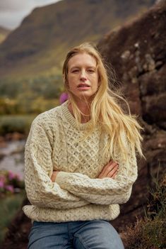 The Islands of Ireland are steeped in Irish mythology, legend and tradition that have inspired our Aran knitwear Collection. Tap into the magic of Irish tradition with our Inishbofin Traditional Aran Sweater. Made with beautiful, high quality Worsted wool, this Aran sweater is the perfect companion to keep you warm and comfortable no matter how you spend your day. You’ll notice that this Aran sweater boasts the traditional Aran honeycomb stitch. Inspired by the fishermen of the past, this stitch Irish Sweaters, Irish Wool Sweaters, Irish Knitwear, Celtic Knot Work, Aran Jumper, Irish Sweater, Irish Mythology, Irish Fashion, Honeycomb Stitch