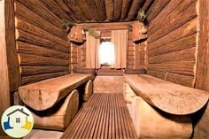 the inside of a wooden cabin with benches