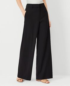 Elevate your wardrobe with the Ann Taylor Wide-Leg Pant in Curvy Fit, a testament to modern style and comfort. Designed specifically for women, these pants feature a flattering high waist and a flowing wide-leg silhouette that enhances your figure while providing an effortless, chic look.

- **Size**: 00 Regular
- **Color**: Black
- **Material**: 62% Polyester, 34% Viscose, 4% Spandex
- **Fit**: Relaxed and easy
- **Length**: Full length, 31" inseam with a 25 1/2" leg opening
- **Rise**: High ri Versatile Wide Leg Pants With Belt Loops, Non-stretch Black Wide-leg Pants, Fitted Black Wide Leg Full-length Pants, Black Stretch Wide Leg Mid-rise Pants, Black Elastane Wide-leg Dress Pants, Black High-waisted Wide Leg Pants With 4-way Stretch, Black Wide Leg Pants, Blazer And Skirt, Style Steal