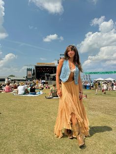 festival outfit. free people. long skirt. flowy skirt. denim vest. music festival. concert outfit. coachella. highwater music festival. summer outfits. boho. beachy. cowboy boots. charleston south carolina. Flowy Skirt Summer Outfit, Boho Flowy Skirt Outfit, Boston Calling Festival Outfits, Country Musical Festival Outfit, Western Outfits Women Festival, Cowboy Boots Outfit Long Skirt, Hinterland Outfit Ideas, Sundress Concert Outfit, Festival Outfit Long Skirt