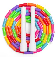 several different colored plastic toothbrushes arranged in a circle on top of each other