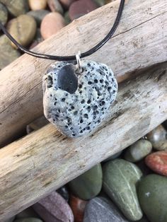 This Natural Stone was gathered from a shore on the Inishowen Peninsula of  Co'Donegal, Ireland. Although this pebble is not a Hag Stone, I have included it because of it's unusual and distinct markings. The pebble is drilled to accept the connecting silver plated link through which the necklace is threaded to form the pendant. Other than the drilled hole this stone has not been altered in anyway and is sold in it's most natural and raw condition. Pebble Pendant, Donegal Ireland, Hag Stones, Pendant Necklaces, Natural Stone, Natural Stones, Silver Plate, Jewelry Necklace Pendant, Crochet Earrings