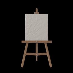 an easel with a white canvas on it