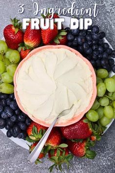 a fruit dip in a bowl surrounded by grapes and strawberries with the words, 3 ingredient fruit dip