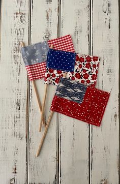 three red, white and blue patchwork coasters sitting on top of each other