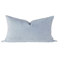 a light blue pillow on a white background