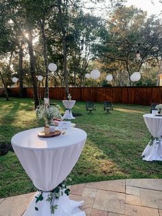 tables set up in the backyard for an event