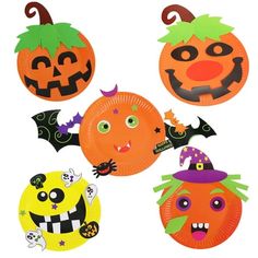 halloween paper plates with faces and decorations on them