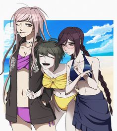 three women standing next to each other on a beach