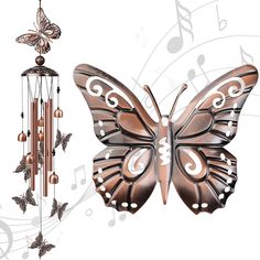 a wind chime with a butterfly on it and music notes in the back ground