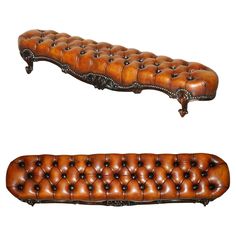 two brown leather couches sitting next to each other on top of a white surface