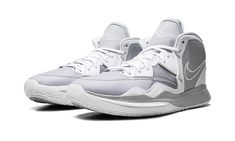 the nike zoom basketball shoe is white and grey