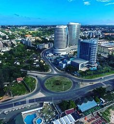 an aerial view of a city with tall buildings