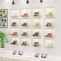 a wall mounted shoe rack filled with lots of different types of high heeled shoes