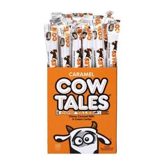 caramel cow tales candy sticks in an orange box