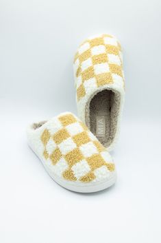 The perfect cozy shoe are these MIA Checker Slippers for Women in Oatmeal/White! Super soft and cozy, these slippers feature a fuzzy lined interior, fun print on top uppers, and a memory foam footbed for extra comfort. Features: MIA Shoes Style: GS1412401-OCC Color: Oatmeal Slippers Fuzzy lined Checkerboard pattern in White and Oatmeal Memory foam footbed Rubber outsoles Slip on Hand wash warm, hang to dry Cozy Synthetic Slippers With Cushioned Footbed, Cozy Slippers With Cushioned Footbed, Comfortable Synthetic Slippers With Soft Sole, Comfortable Slippers With Soft Sole, Cozy Synthetic Slippers With Textured Footbed, Comfortable White Slippers With Cushioned Footbed, Comfy Super Soft Slippers For Leisure, Cozy Indoor Slippers With Cushioned Footbed, White Casual Slippers For Lounging