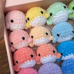 small crocheted stuffed animals in a pink box