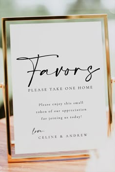 a sign that reads favors please take one home and is on top of a table