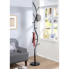 With its modern branch design, this Arles Metal Black and Walnut Standing Coat Rack is no ordinary coat rack. It holds your coats and hats in style. The curvy metal base is sturdy and finished in black. Wooden accents in a walnut finish provide a dapper spot for coats, hats, umbrellas, and more.   Features: 9 hooks in various positions. Metal construction with wood hook ends. Black finish with walnut accents. Heavy round base for stability. Dimensions:  Overall dimensions: 11"W x 11"D x 74.8"H. Due to the difference of monitor colors, some colors may vary slightly. We try to represent all colors accurately. Please refer to the text above for a description of the colors shown in the photo. Black And Walnut, Standing Coat Rack, Business Decor, Branch Design, Hall Tree, Coat Racks, Wood Detail, Declutter Your Home, Entryway Furniture