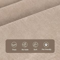 the back side of a beige fabric with buttons on it and an image of a dog's paw